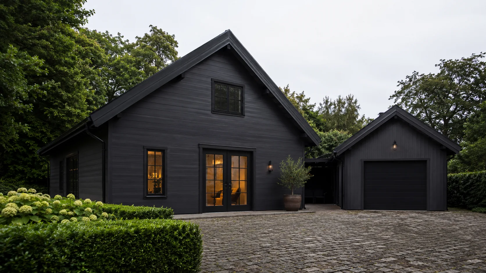 Dark timber house with detached garage
